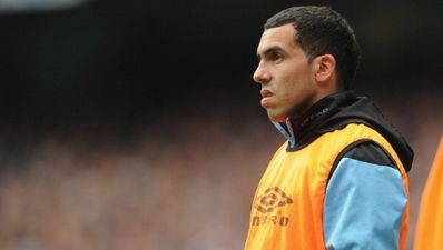 Toy-throwing Carlos Tevez on his bike from Manchester and England