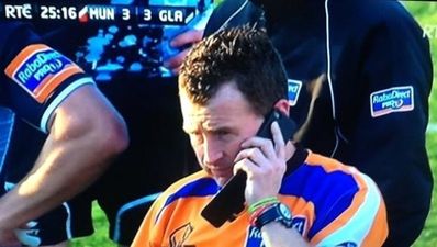 What was Nigel Owens doing on his mobile phone during the Munster match last night?