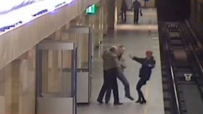 Video: Man heroically saves woman after she’s pushed onto subway tracks