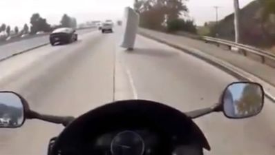 Video: Watch the luckiest motorcyclist alive