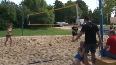 Video: Beach volleyball game ends with a girl face first in crotch