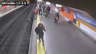 Video: Woman has a lucky escape after falling onto train tracks