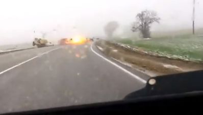 Video: Overtaking on a bend in the wet is not a good idea