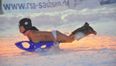 Thousands show their support for topless tobogganing contest