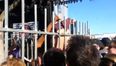 Video: Girl wedgies herself while trying to hop the fence at a festival