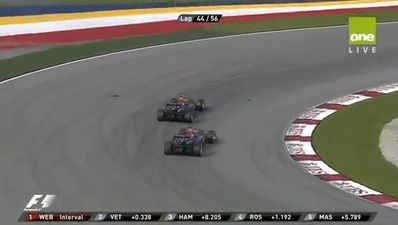 Mark Webber gives Sebastian Vettel the finger at today’s Malaysia Grand Prix
