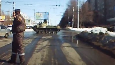 Video: Russian soldier hits streetlight while driving tank
