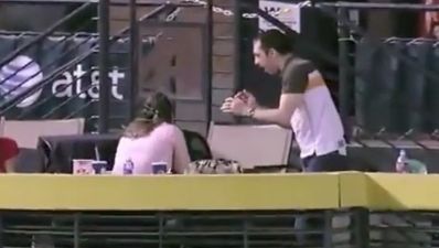 Video: Woman hit by baseball after boyfriend dives for cover