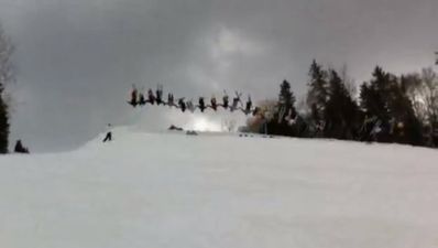 Video: Watch as 30 skiers land incredible multi-person backflip