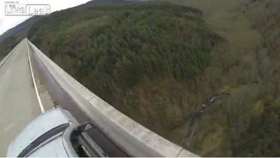 Video: Watch as two adrenaline junkies BASE jump off a moving car
