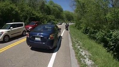 Video: Very lucky biker narrowly avoids truck crash