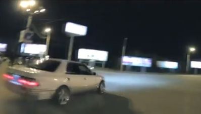 Video: Midnight drifter nearly kills cameraman