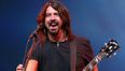 Pic: Dave Grohl plays barman on stage by pouring a beer for a fan
