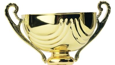 The cheek – check out the mirror as player admires his Player of the Year award