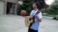 Video: Can you play a guitar while dribbling a basketball? This guy can…