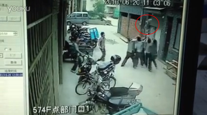 Video: Couriers catch two-year-old as she falls from fifth-story building