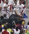 Pic: The Irish lad injured in the Pamplona bull run puts a brave face on it in hospital