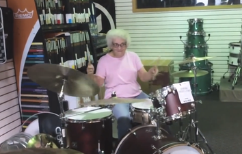 Video: Elderly granny rocks out on a shop floor drum kit