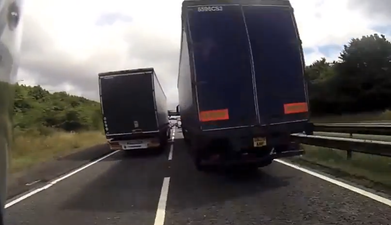 Video: Lane chopping motorcyclist gets sandwiched between two trucks… (NSFW-ish)