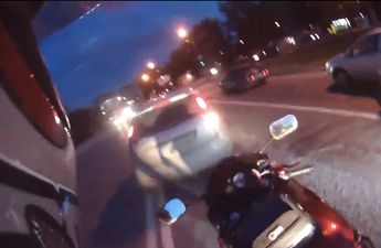 Video: Motorcyclist loses road rage battle with car