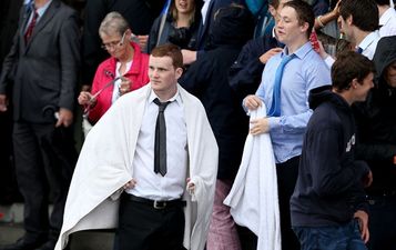 Video: Punter at the Galway Races caught wiping his wet face with a €50 note on live TV