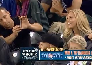 Video: Guy at baseball game has absolutely zero shame in taking picture of attractive woman next to him