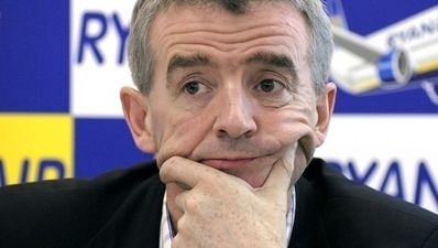 Pic: Michael O’Leary gets his hands dirty at a Ryanair check-in desk