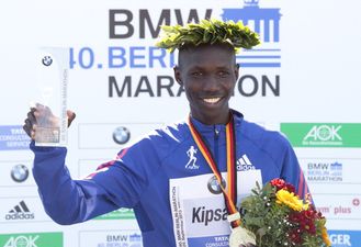 Video: Marathon record breaker upstaged by finish line crasher…