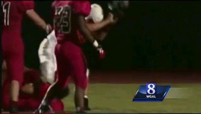 Video: American football player beats another over the head with his helmet