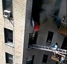 Video: Dramatic footage of a man being rescued from a burning apartment in Manhattan