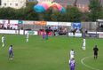 “He dived ref!” – Parachutist bizarrely lands on football pitch in the middle of game