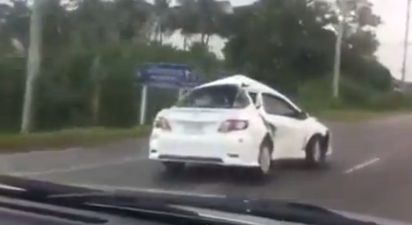 Video: This mangled car is somehow still driving on the motorway