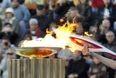 Video: Russian security agent breaks tradition and relights Olympic torch with a Zippo
