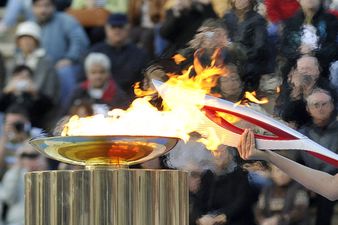 Video: Russian security agent breaks tradition and relights Olympic torch with a Zippo