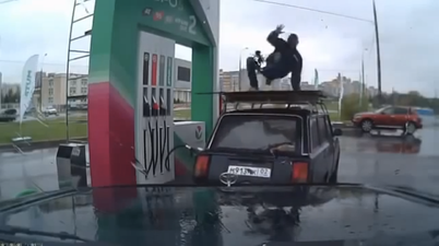 Video: Russian fuel attendant break dances on top of customer’s car