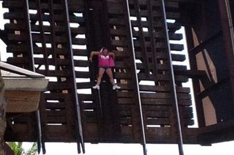 Video: Woman left clinging to railway bridge 22 feet in the air after railway crossing opens