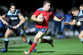 Picture: Munster’s J.J. Hanrahan with an epic hand off in tonight’s game against Glasgow