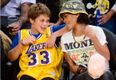 This young lad looked delighted to be sitting next to Rihanna at the Lakers game