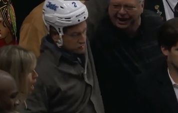 Video: Ice-hockey player gets hit with crunching tackle; has helmet taken off and beer spilt over his head by drunken fans