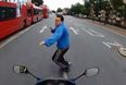 Video: Motorcyclist nearly runs over pedestrian crossing the road; his reaction is priceless