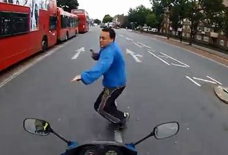 Video: Motorcyclist nearly runs over pedestrian crossing the road; his reaction is priceless