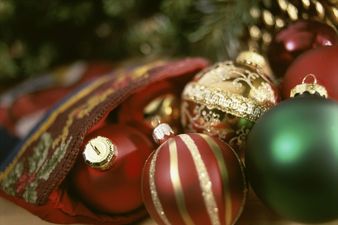 Picture: These lads on Harcourt Street have found the most dangerous way to hang up the Christmas decorations