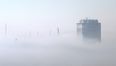 Pic: Amazing shot of London skyscrapers poking through a thick fog