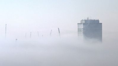 Pic: Amazing shot of London skyscrapers poking through a thick fog