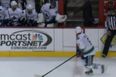 Video: Ice hockey goalie makes a save…from the bench