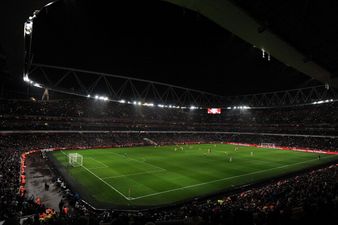 Arsenal fans shine a light on the Emirates Stadium after floodlights go out