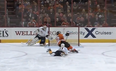 Video: Ice hockey goalie makes incredible diving save