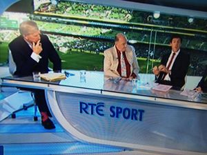Pic: Tom McGurk tries to distract from George Hook’s suit with his funky socks