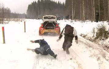 Video: Rally driver drags a helpful spectator to the ground