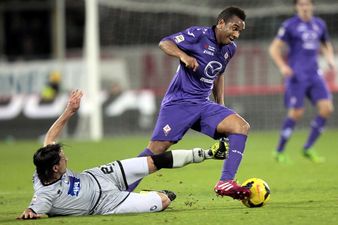 Anderson breaks Papal Law by taking a picture of the Pope inside the Vatican